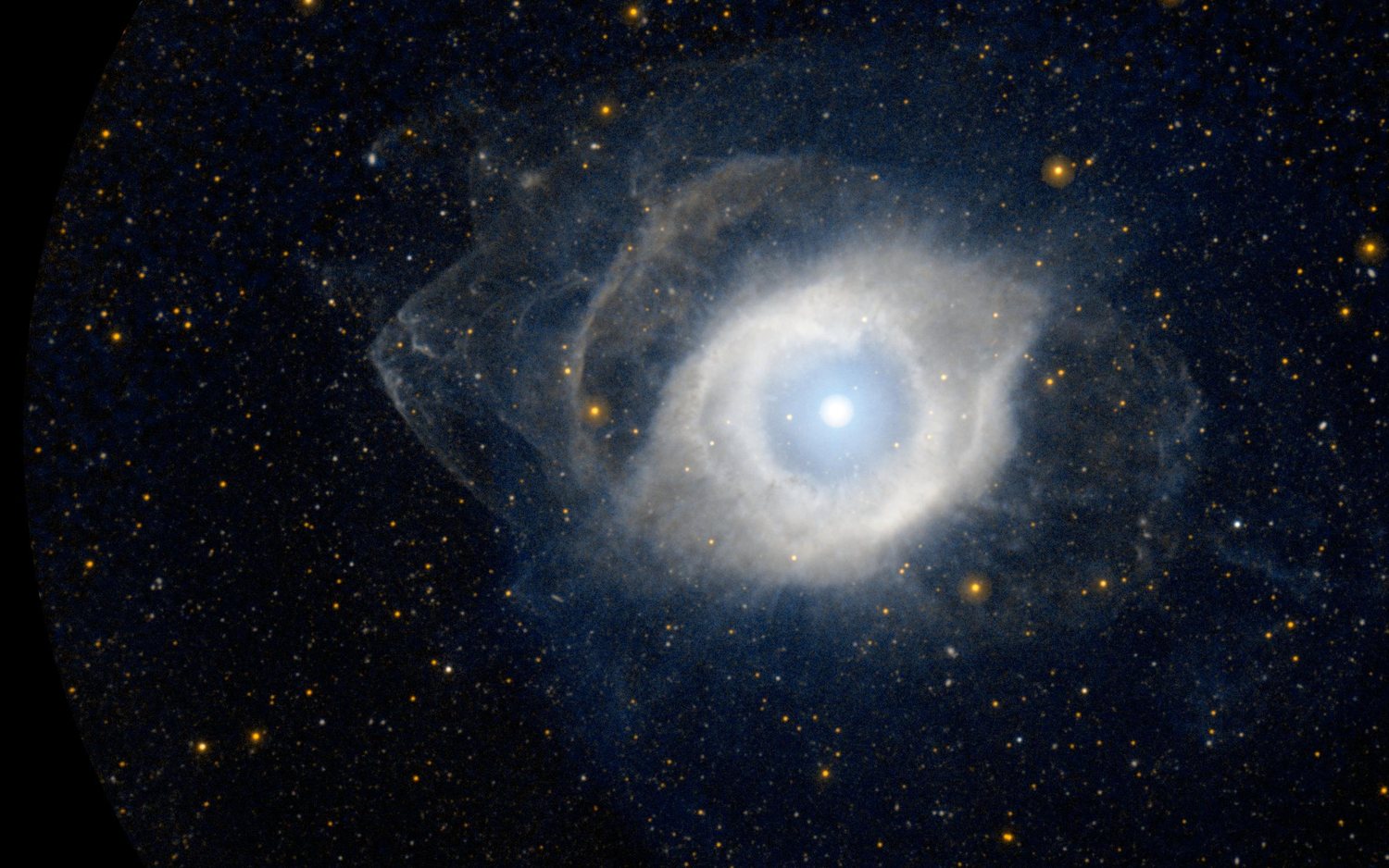 The Helix Nebula, a ring of gas cast off by a dying star, imaged by NASA's GALEX telescope