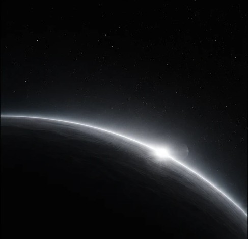 A planet's limb catching the first light of its sun, a smaller moon just beyond the terminator